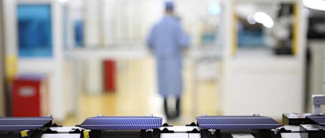 Solar cells on a conveyor belt at JA Solar