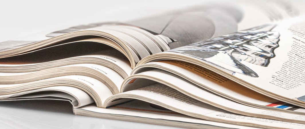 Stack of magazines containing articles on polysilicon written by Johannes Bernreuter, founder of Bernreuter Research
